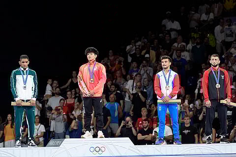 Paris Olympics men's freestyle 65kg wrestling: Iran's Rahman Amouzadkhalili, silver, Japan's Kotaro Kiyooka, gold, Puerto Rico's Sebastian Rivera, Albania's Islam Dudaev, bronze